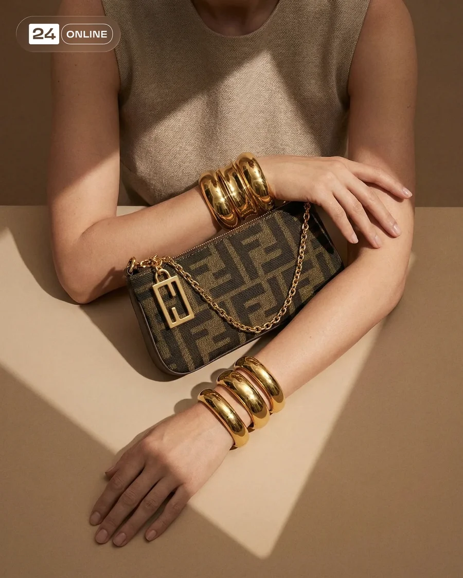 Luxury editorial shots of a brown monogram mini shoulder bag with gold chain. — AI-generated example 2 of 5