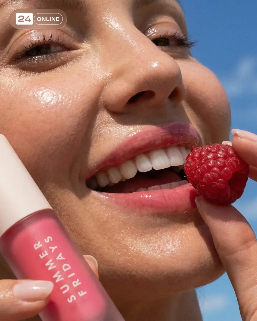 Hyper-real beauty lip gloss campaign with dewy skin, raspberries, and bright… — AI-generated example 2 of 5