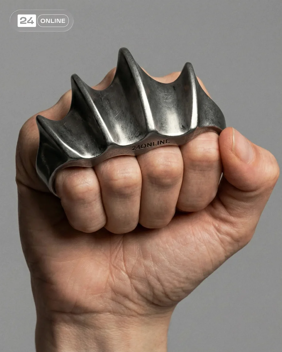 Hyper-realistic studio close-ups of edgy wearable metal and body accessories. — AI-generated example 4 of 5