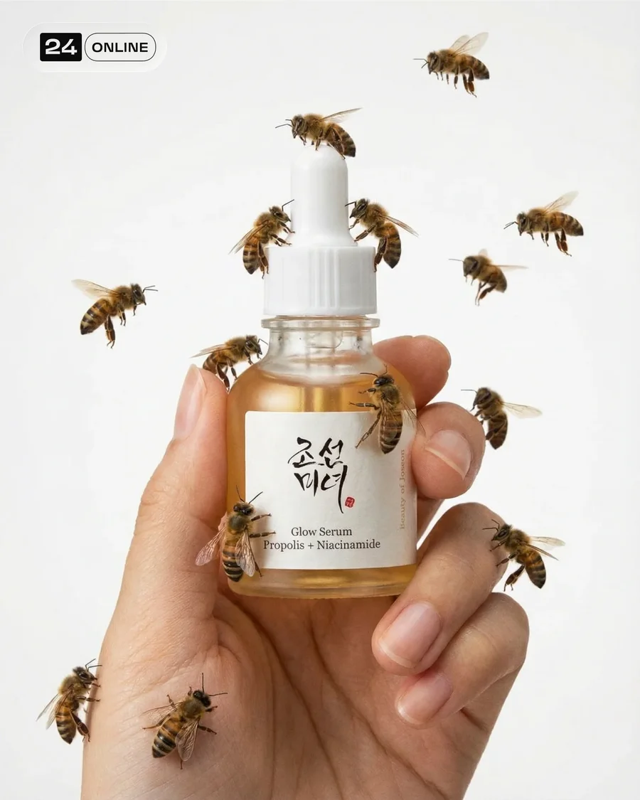 Luxury serum bottle in hand with insects or snails, clean white studio style — AI-generated example 4 of 4