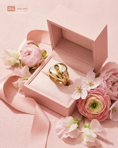 Luxury floral editorial jewelry photography with pastel romance and polished gemstone details.