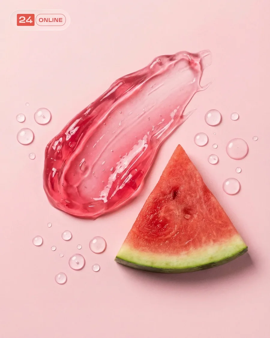 Glossy pink skincare gels with watermelon accents in fresh macro beauty… — AI-generated example 2 of 5