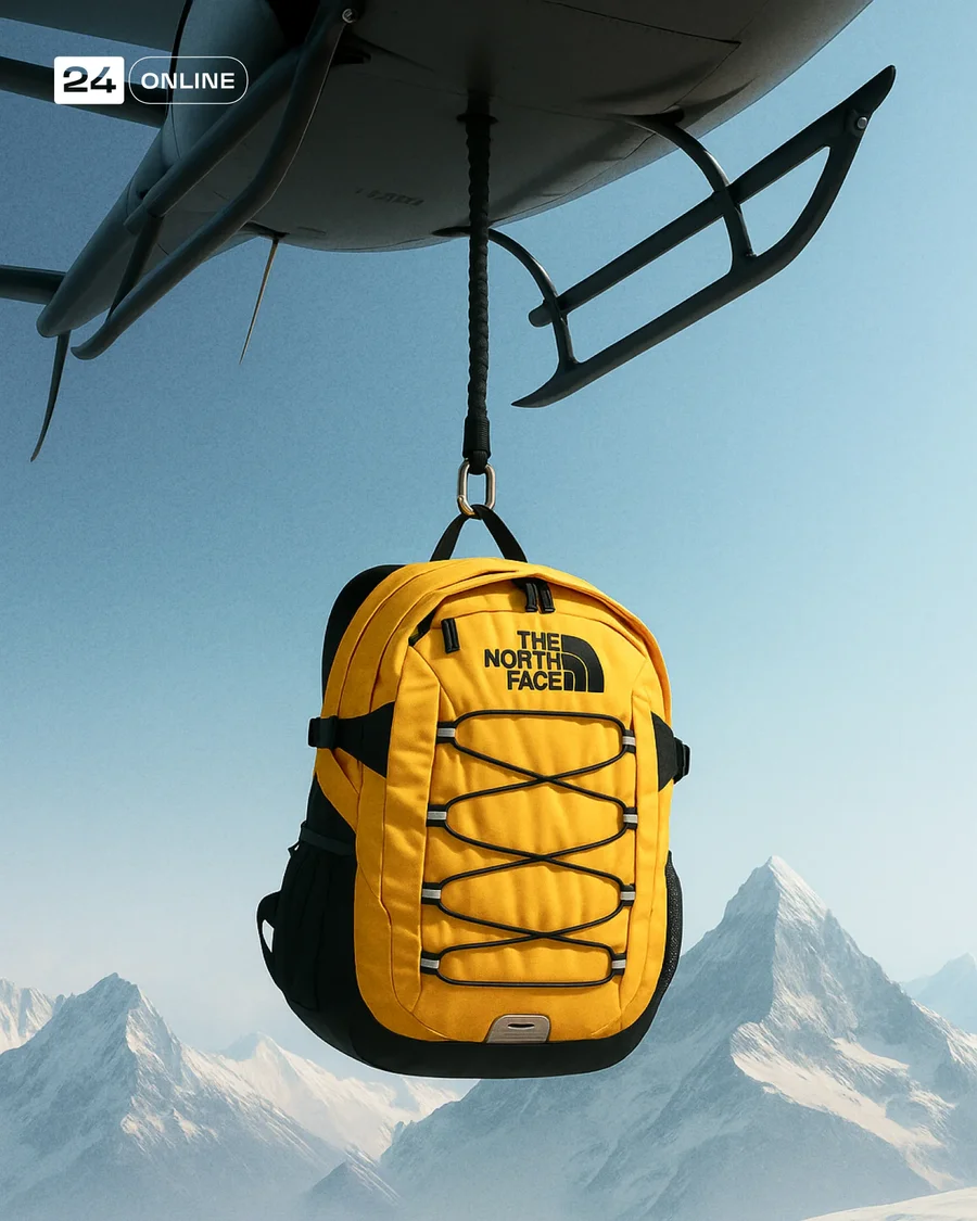 Luxury product suspended beneath helicopter over snowy mountains in cinematic… — AI-generated example 3 of 3