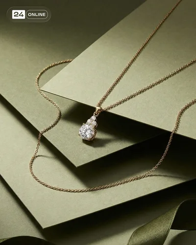 Luxury editorial jewelry photography with sculptural props, soft lighting, and refined colorful backgrounds.