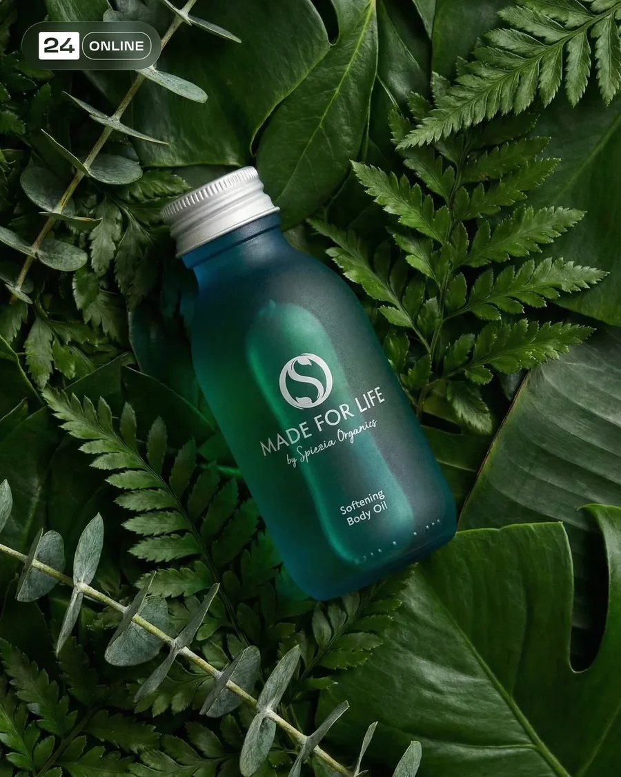 Premium frosted green body oil bottle in editorial skincare studio and natural… — AI-generated example 2 of 4